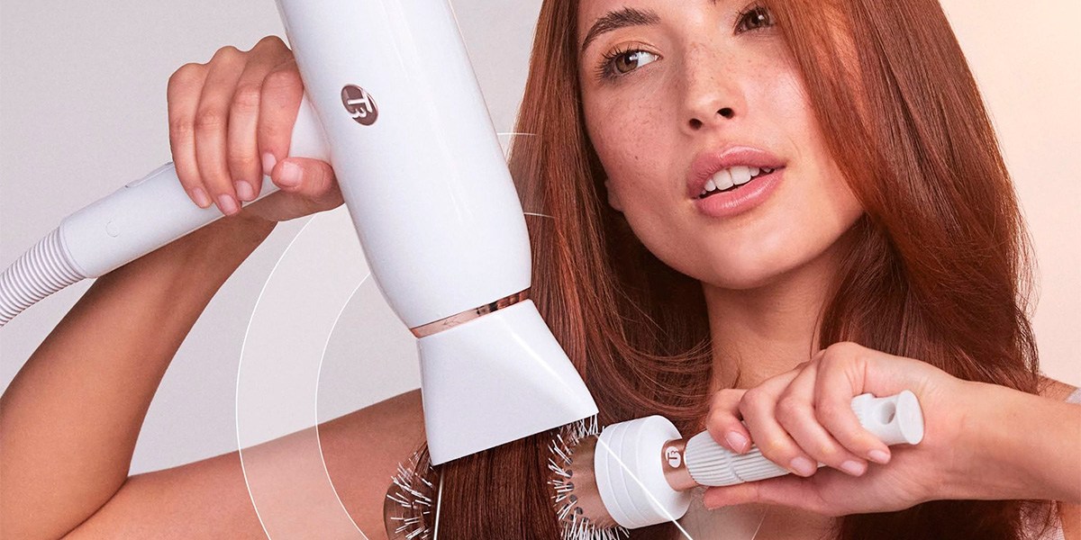 Woman styling hair with T3 Featherweight StyleMax Woman styling hair with T3 Featherweight StyleMax