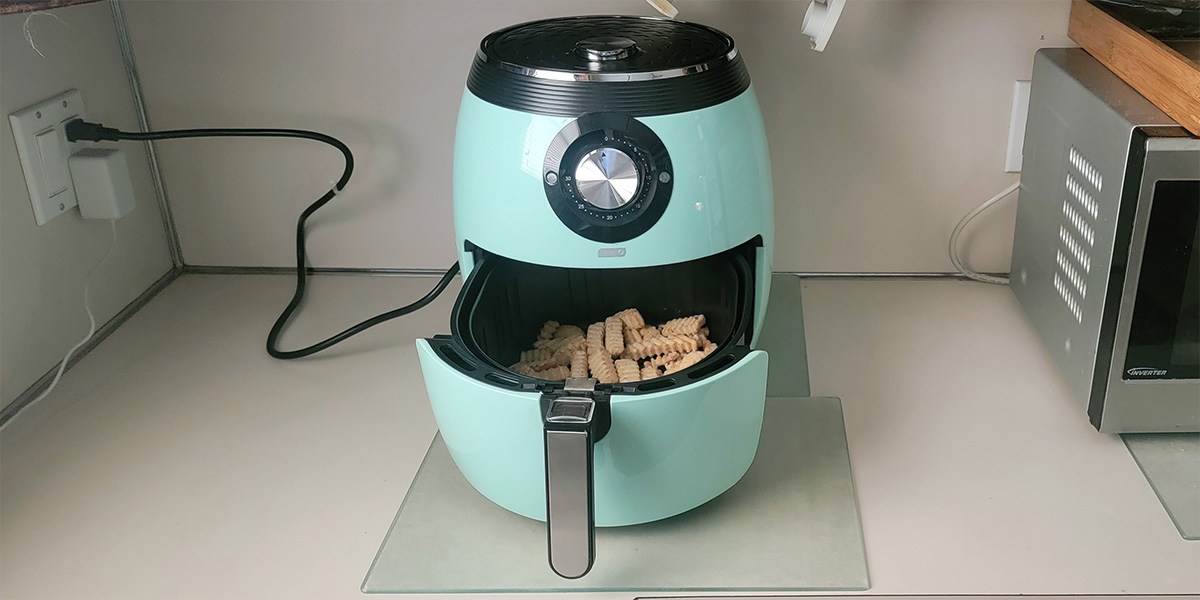 Air fryer with fries in basket Air fryer with fries in basket