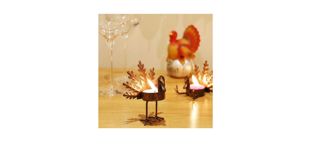 2 metal turkey tea light candle holders on a table 2 metal turkey tea light candle holders on a table