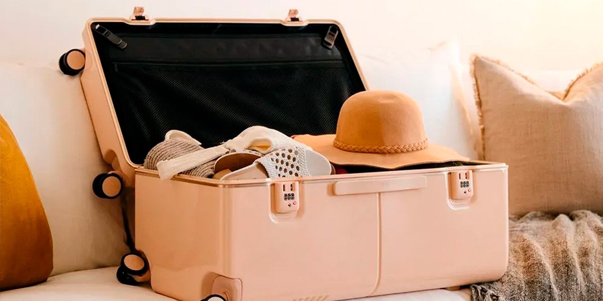 Light pink July Checked Trunk open on sofa Light pink July Checked Trunk open on sofa