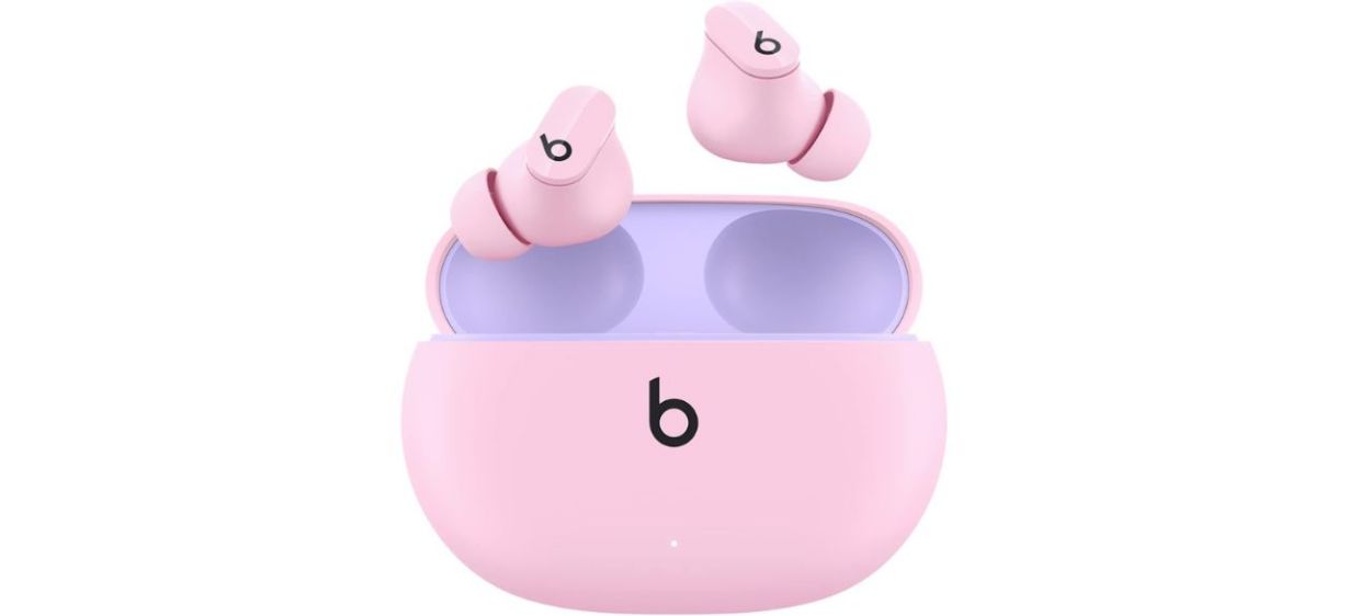 Pink Beats earbuds on white background