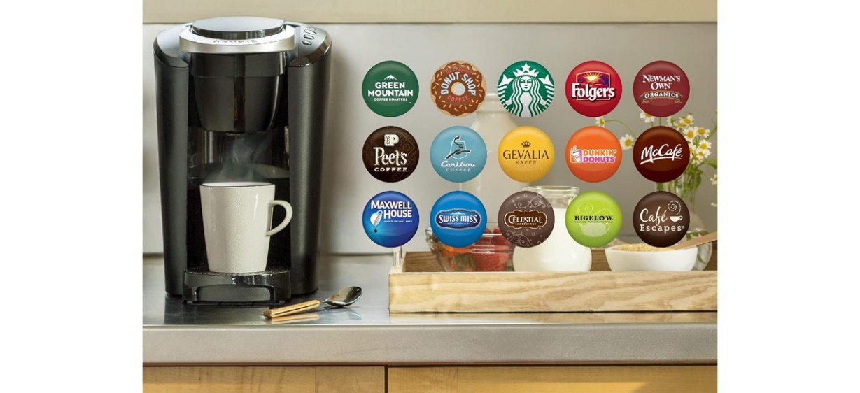 Black Keurig K-Compact Single-Serve K-Cup Pod Coffee Maker with white cup on countertop