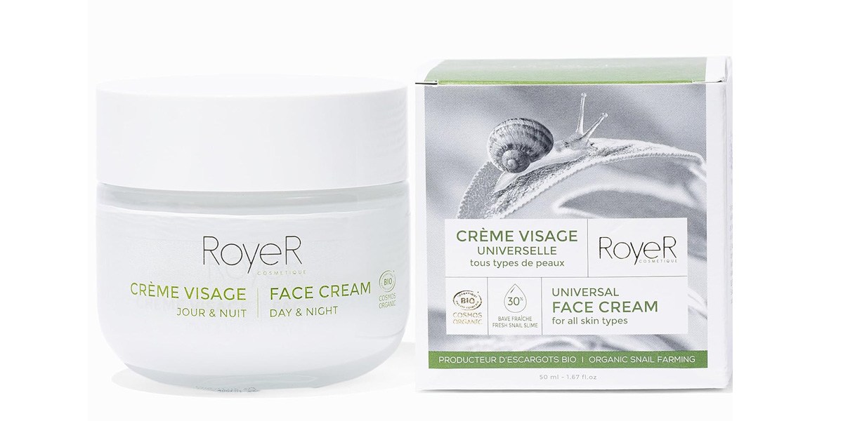 Moisturizer in plastic container next to box containing the words RoyeR Snail Mucin. 