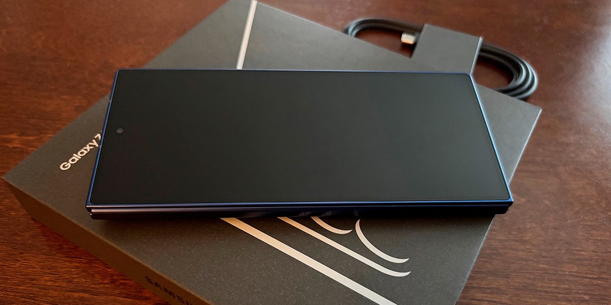 Samsung Galaxy Z Fold7 phone, front view, unfolded, sitting on top of an instruction manual on a table